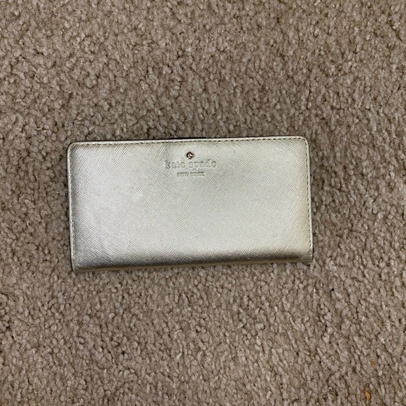 kate spade Handbags - Kate Spade New York Metallic Gold Slim Bifold Wallet